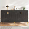 Black sideboard (152 x 40 x 75 cm) with unique wave design and golden handles and feet, creating an elegant dining area